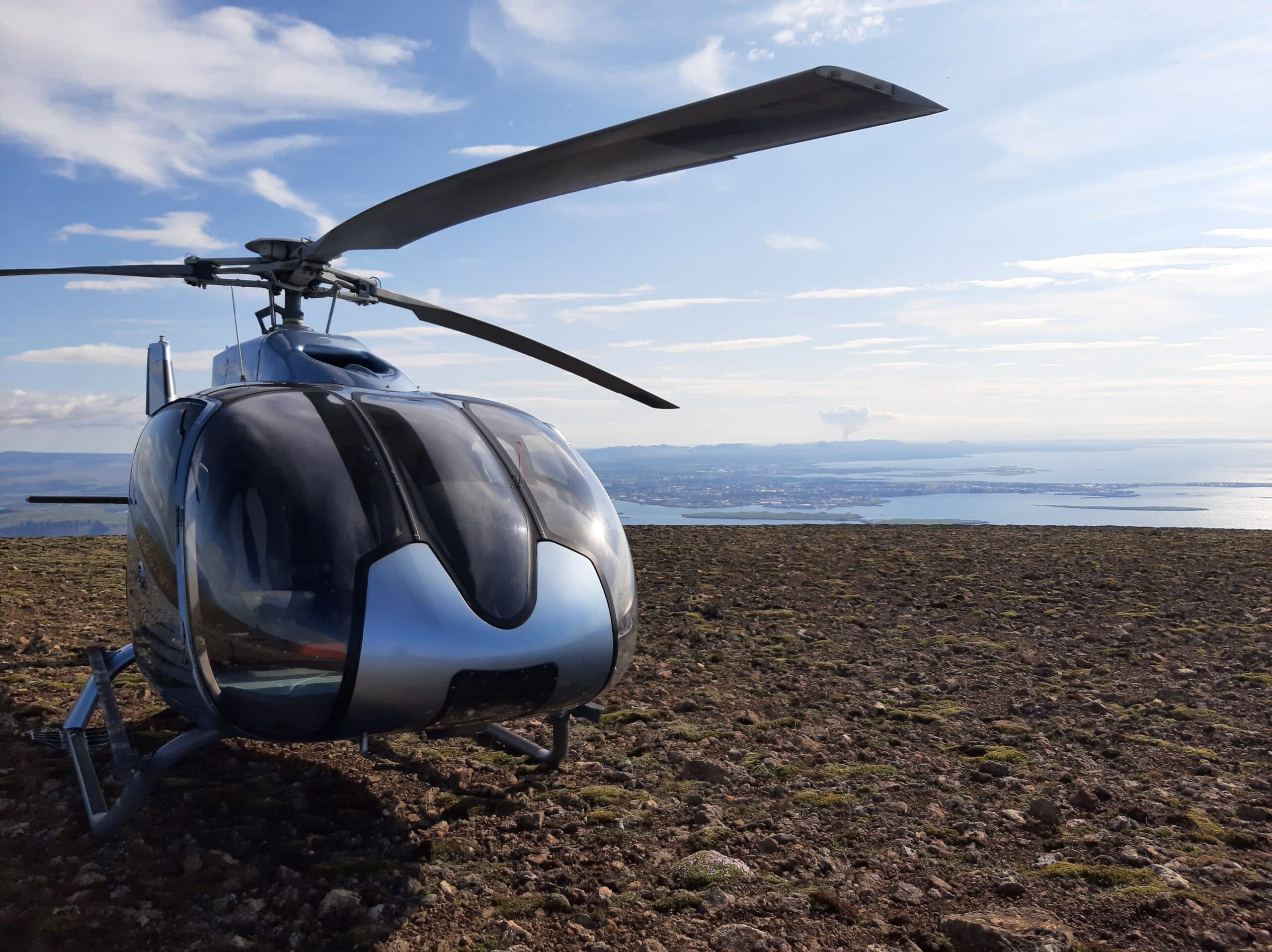 Helicopter flying over a mountain range