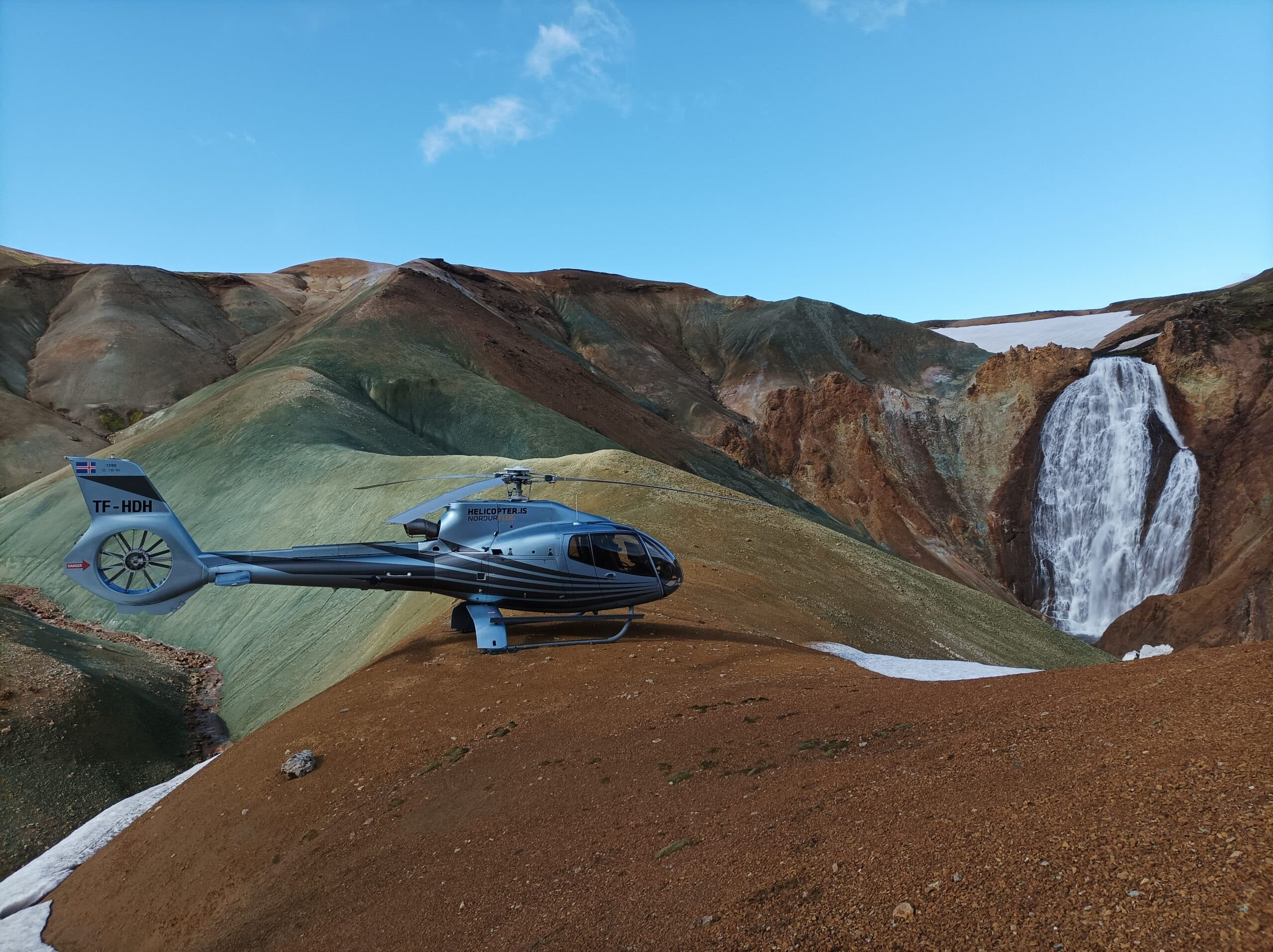 Helicopter flying over a mountain range